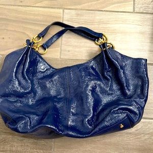 Hobo blue patent leather sling bag.